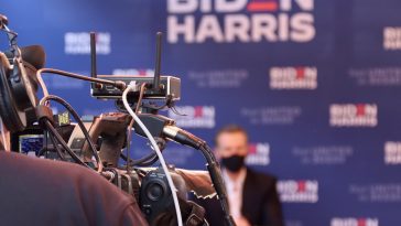 black and silver bicycle in front of the man in black shirt