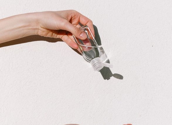Person Holding Hand Sanitizer
