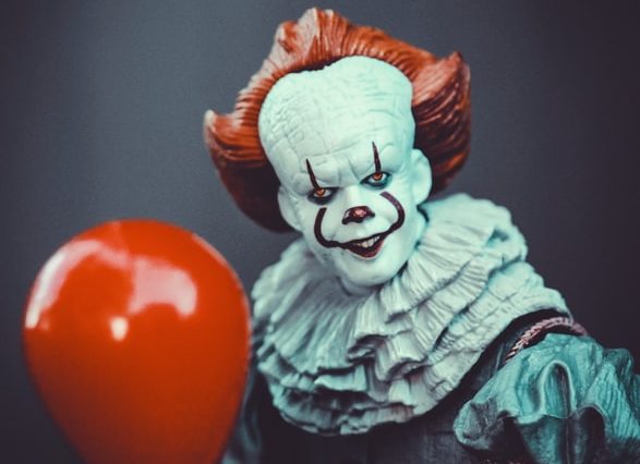 red ball on brown wooden surface