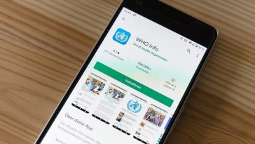 black android smartphone on brown wooden table