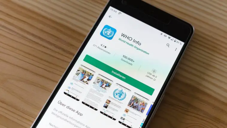 black android smartphone on brown wooden table