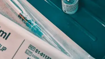 white and black labeled bottle