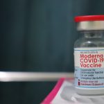 white and red labeled bottle