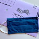 blue denim jeans on white and black textile